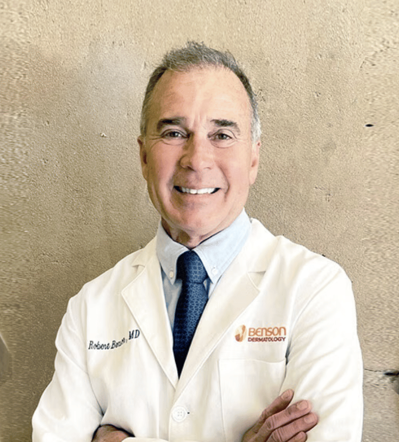 Three medical team members at Benson Dermatology smiling together.