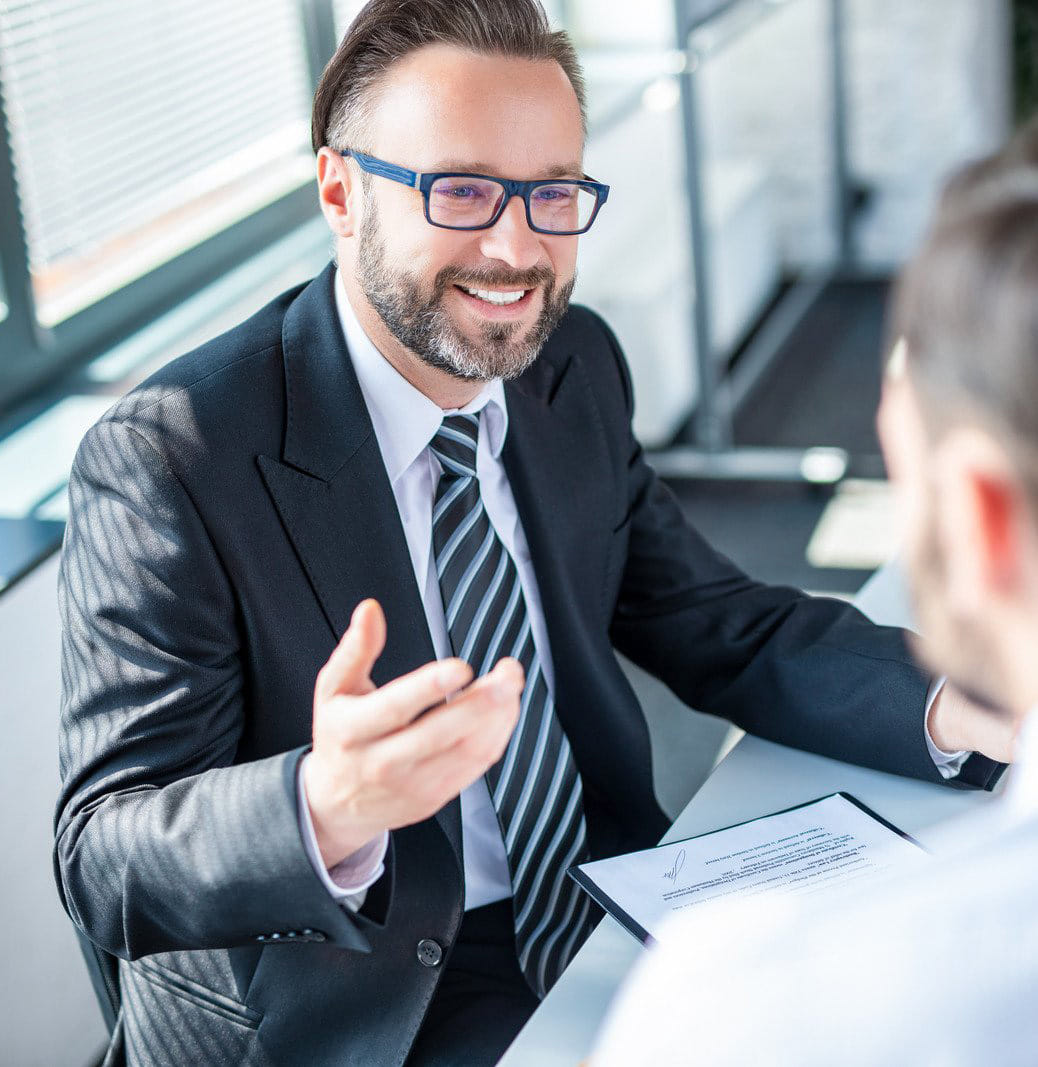 Real estate attorney consulting with client during property closing Real estate attorney consulting with client during property closing