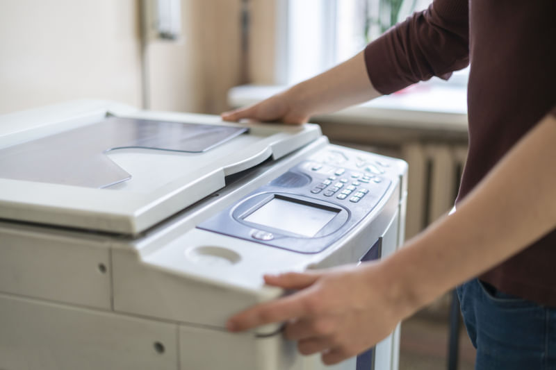 person customizing modern printing machine
