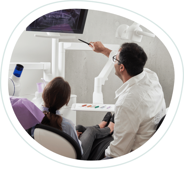dentist going over dental scan with patient