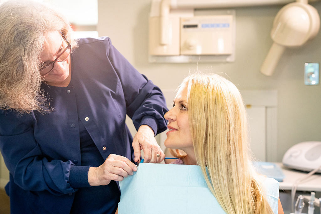 dental hygienist speaking to patient