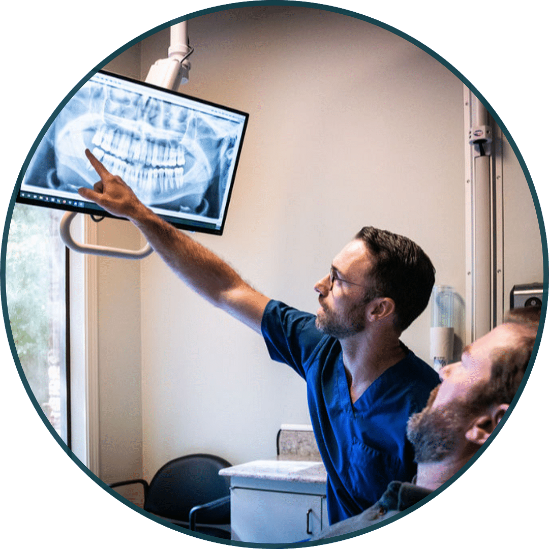 dentist analyzing dental x-ray