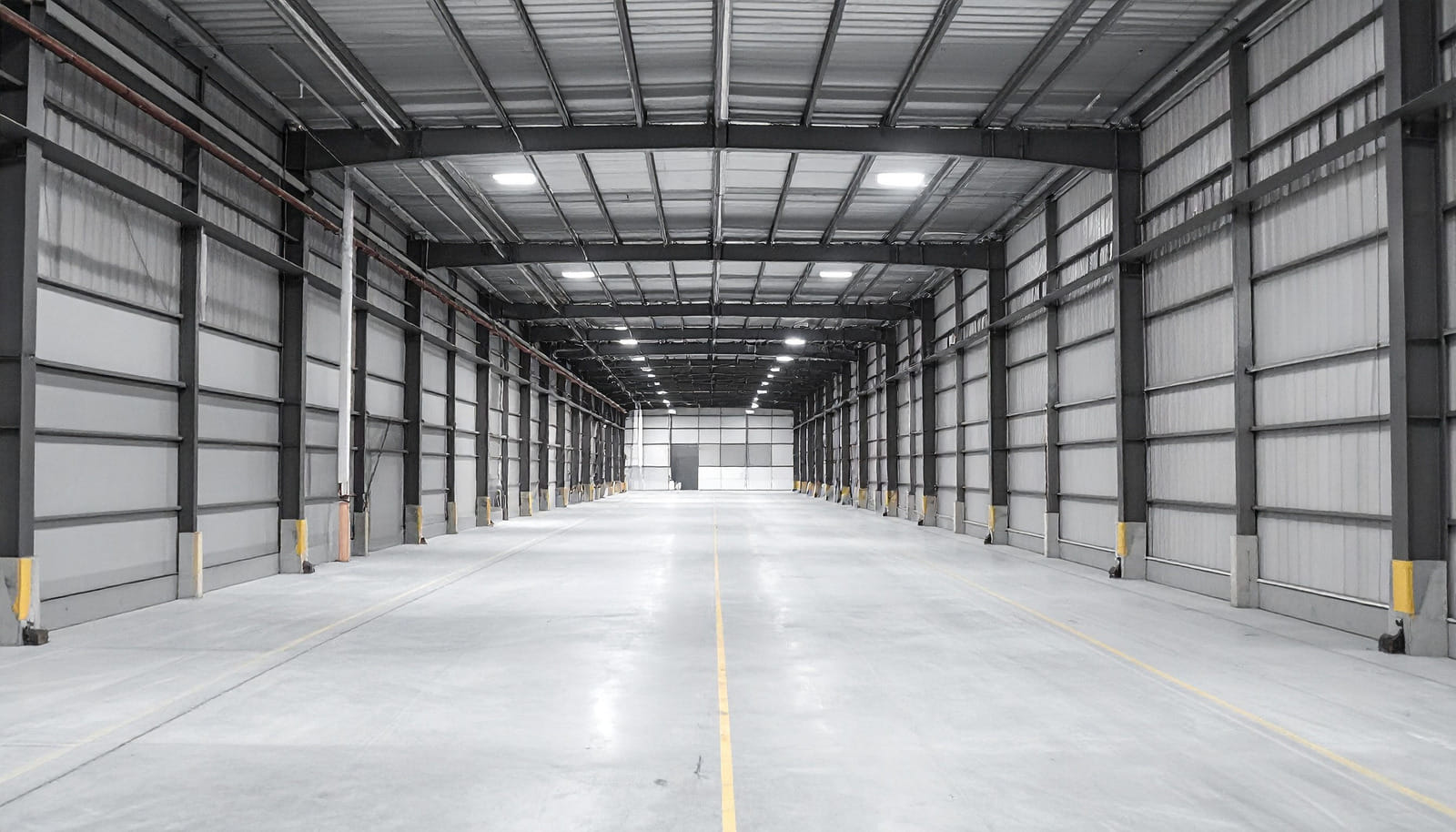 Empty warehouse interior with exposed metal building structure