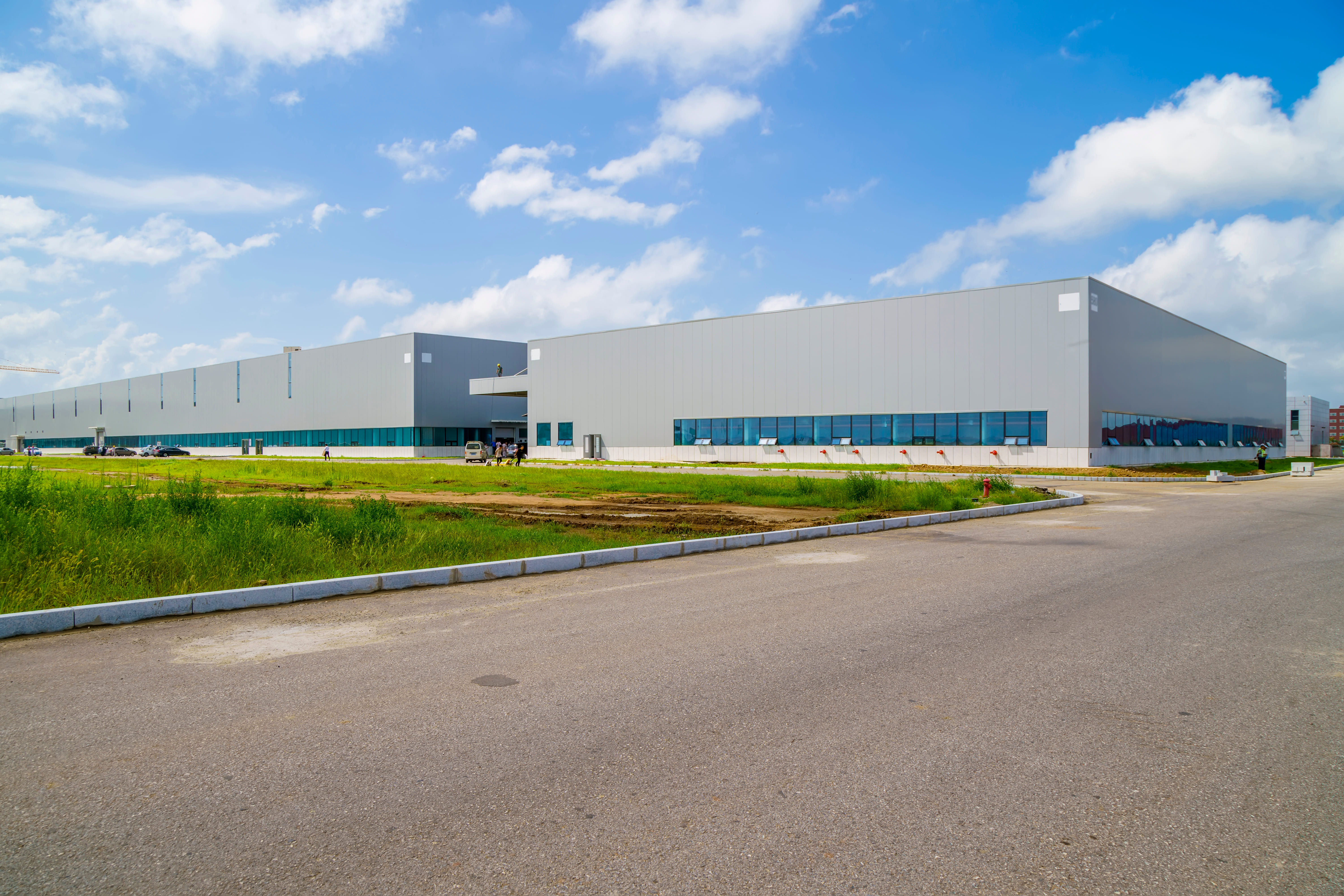 Metal warehouse and factory buildings in an industrial park