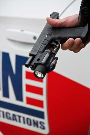 security officers holding a gun