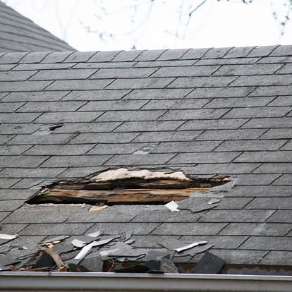 Gray roof with shingle damage Baton Rouge, LA